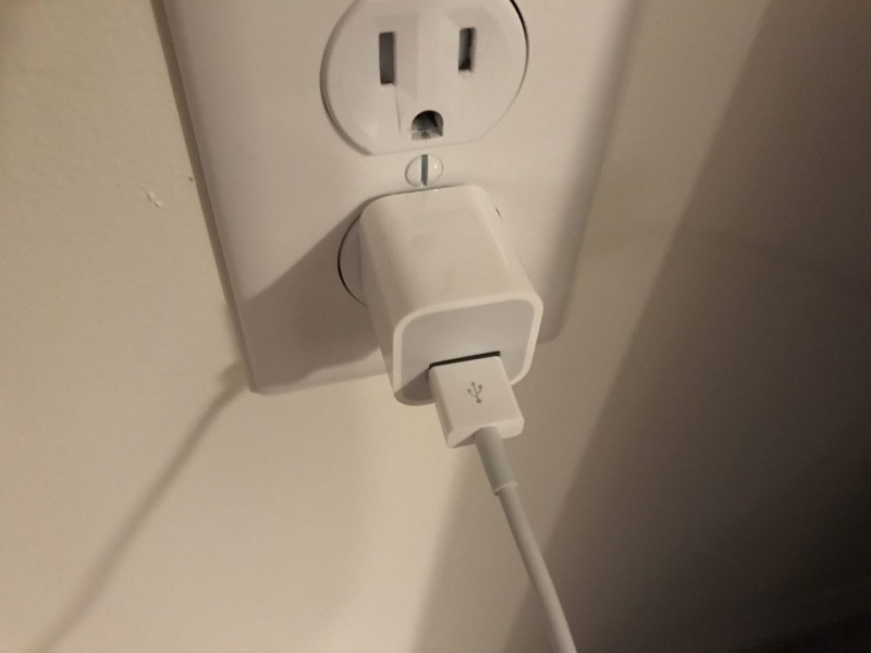 Try plugging iPhone into a different outlet