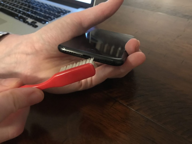 Use toothbrush to brush out iPhone lightning port